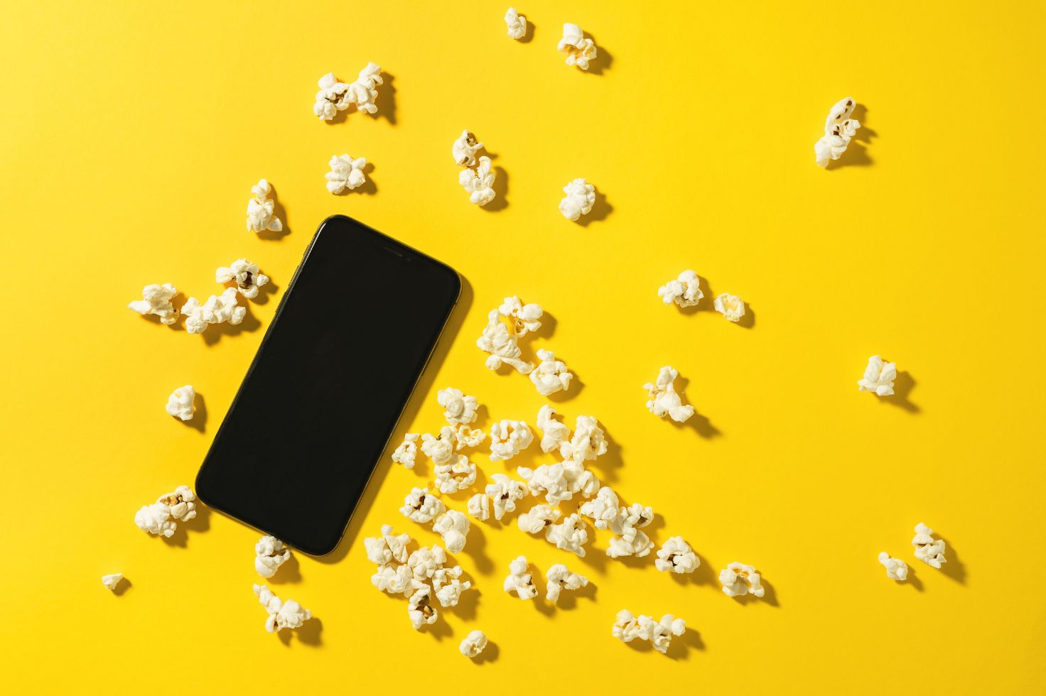 Netflix adtech - smart phone and popcorn